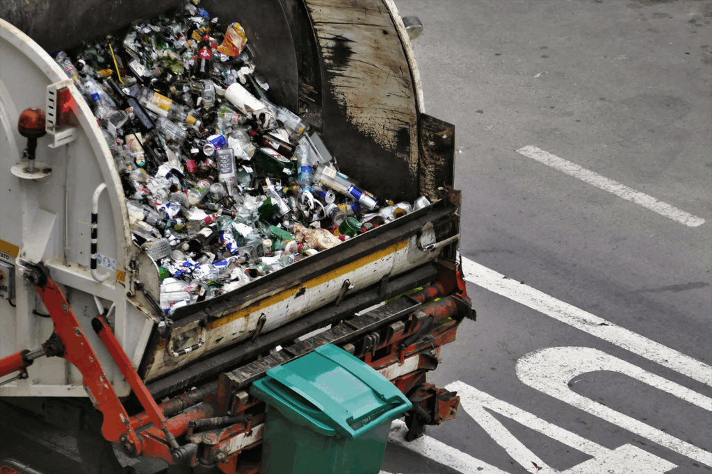 Garbage trucks collecting glas and metall waste
